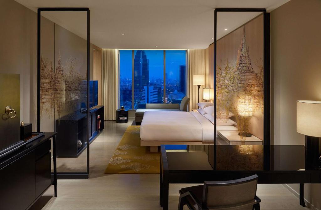 The sleek and artistic interior of a suite at Park Hyatt Bangkok, designed by Yabu Pushelberg.