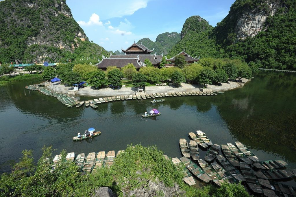 [An elevated view of the Trang An grottoes in Ninh Binh, often called the 'Ha Long Bay on land' in our Vietnam travel guide.]