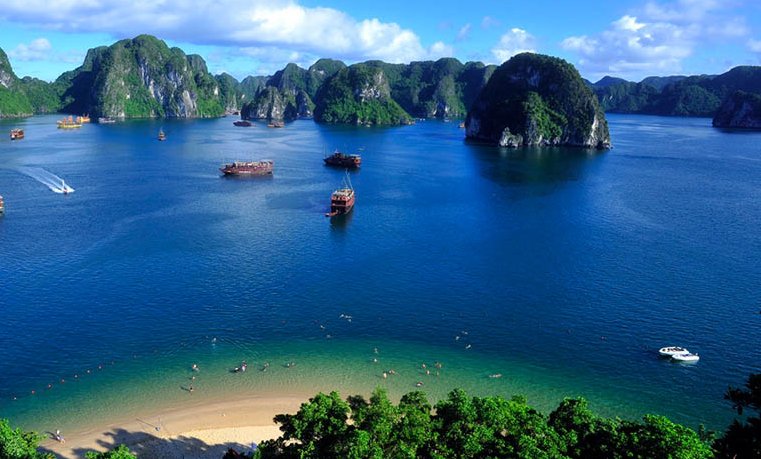 [The stunningly clear turquoise water surrounding Titop Island in Ha Long Bay.]