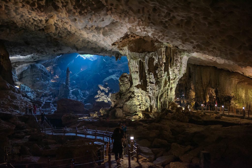 [The tranquil entrance to Luon Cave, leading to a hidden lagoon in Ha Long Bay.]