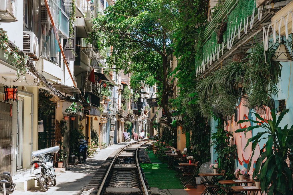 [A glimpse into the charming and verdant alleyways of Hanoi's Old Quarter, showcasing the city's unique atmosphere.]